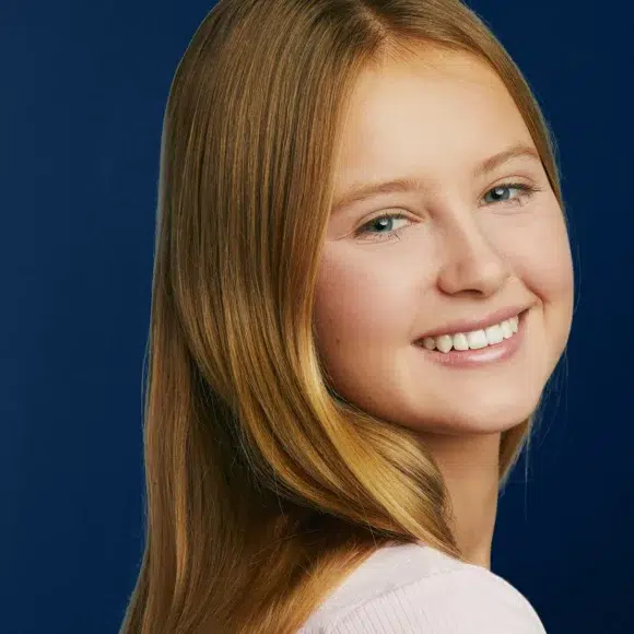 Girl showing orthodontic treatment results | Lakeside Orthodontics - Eagan & St. Paul, MN